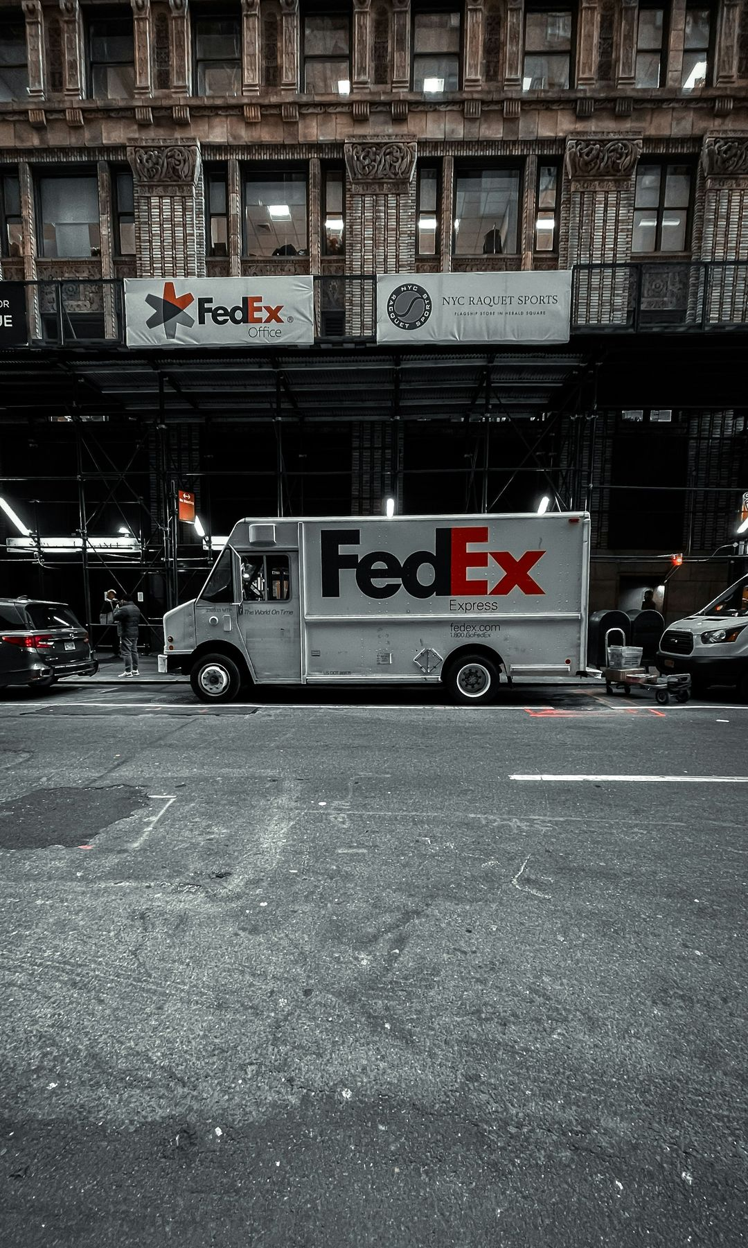 A fed ex truck parked in a parking lot